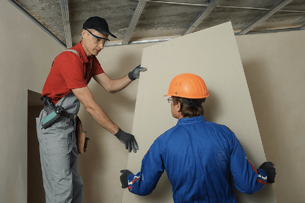tradesman handing an FRP panel for installation