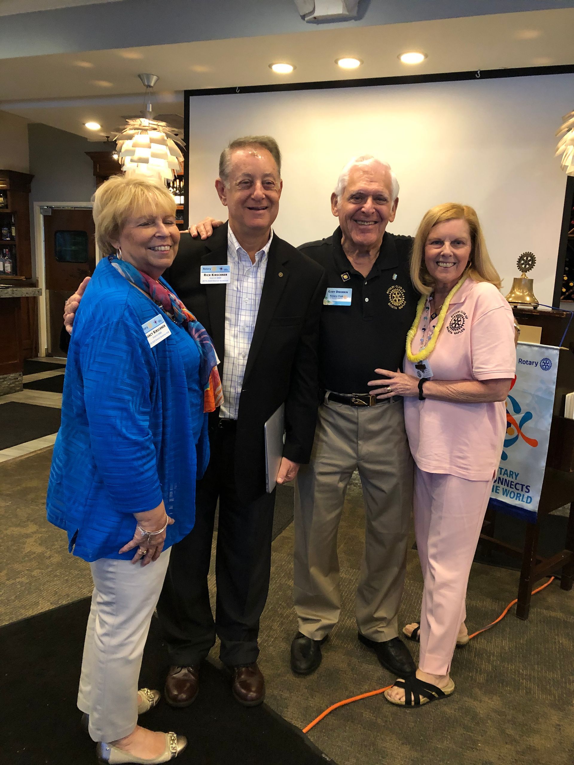 A group of people are posing for a picture in a room.