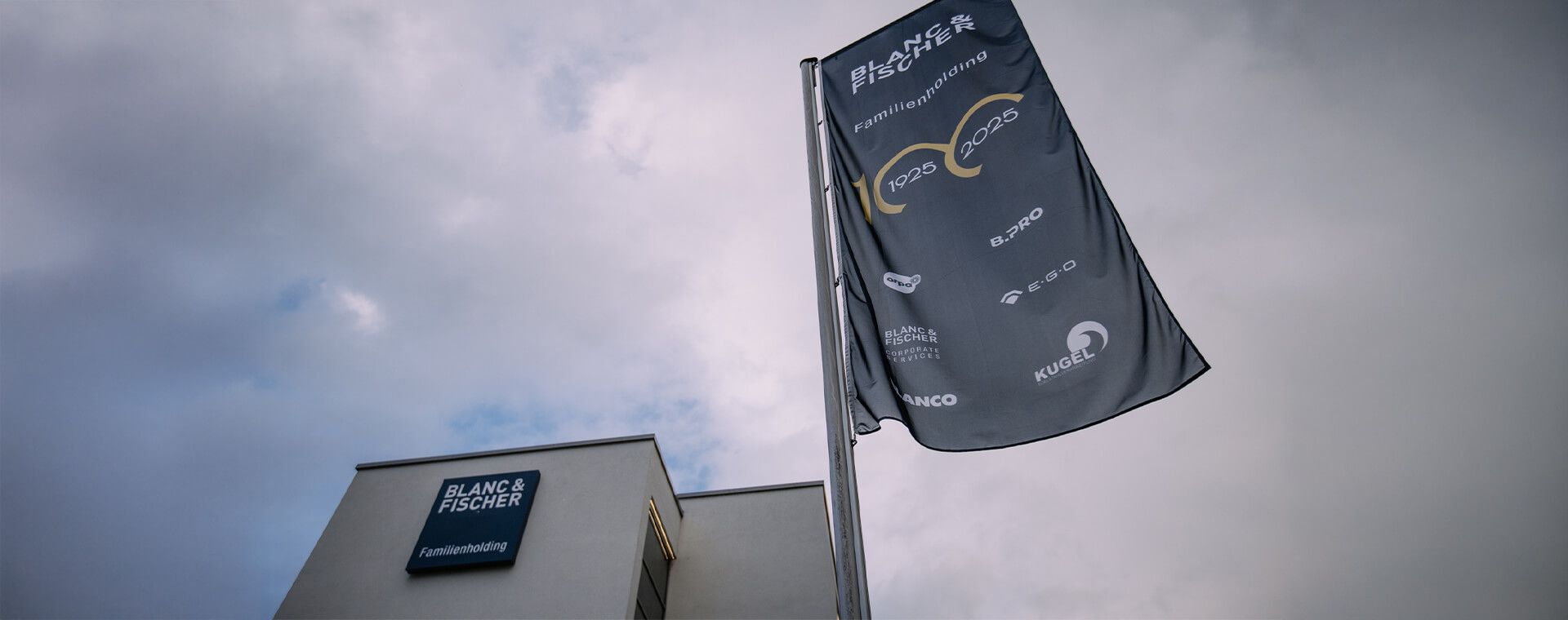 A large supermarket with a wooden facade and a lot of windows.