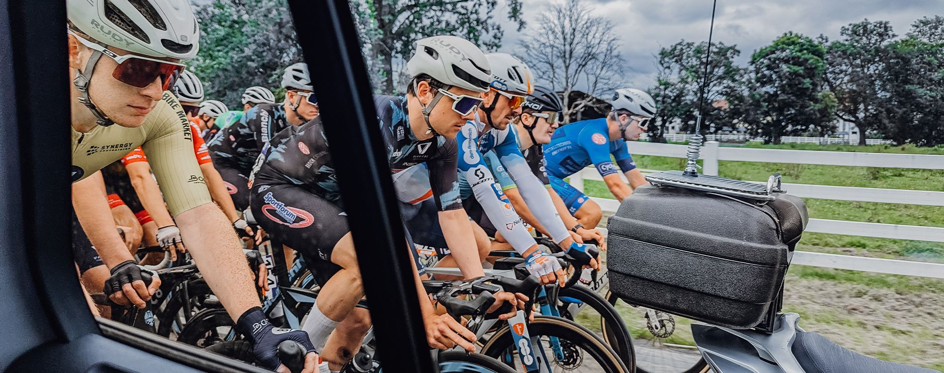 A group of people are riding bicycles in a line.