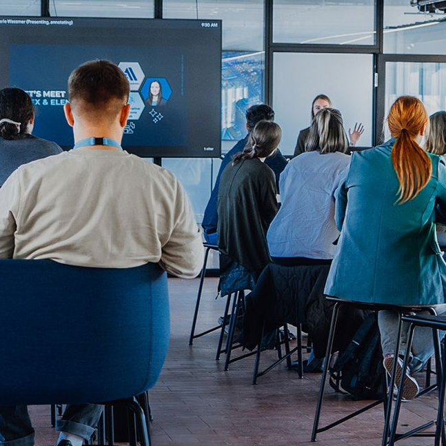 Hand holding a blue card with