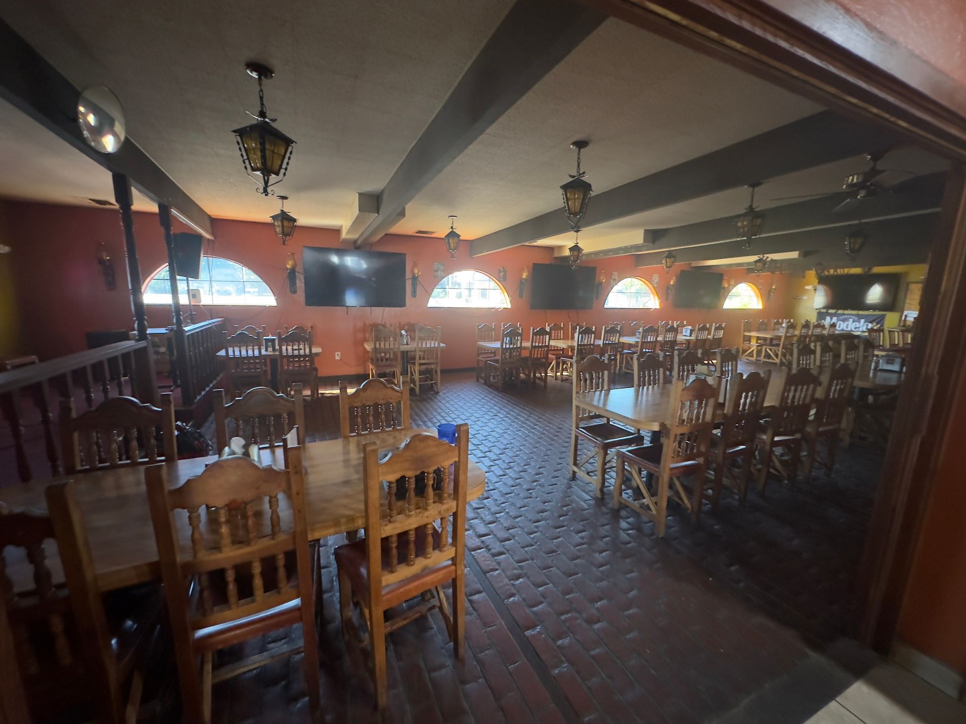 a tray of shot glasses filled with shrimp and lime slices