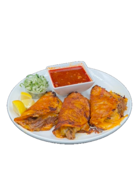 Plate of three birria tacos with a bowl of red sauce, lemon slices, and slaw.