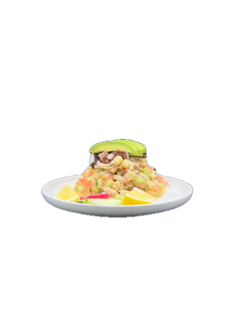 Seafood ceviche with avocado on a white plate, garnished with lemon wedges.