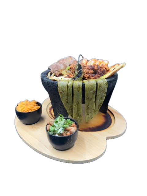 Molcajete dish in a stone bowl, with side dips, on a wooden tray.