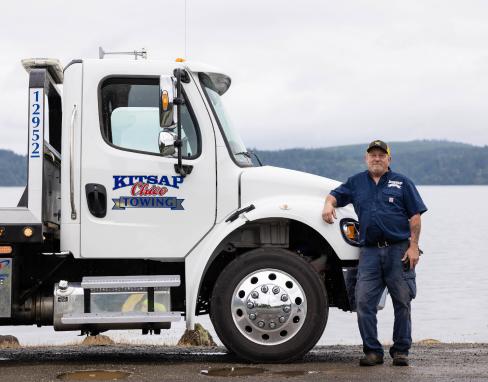 Man Standing With Vehicle | Kitsap Chico Towing