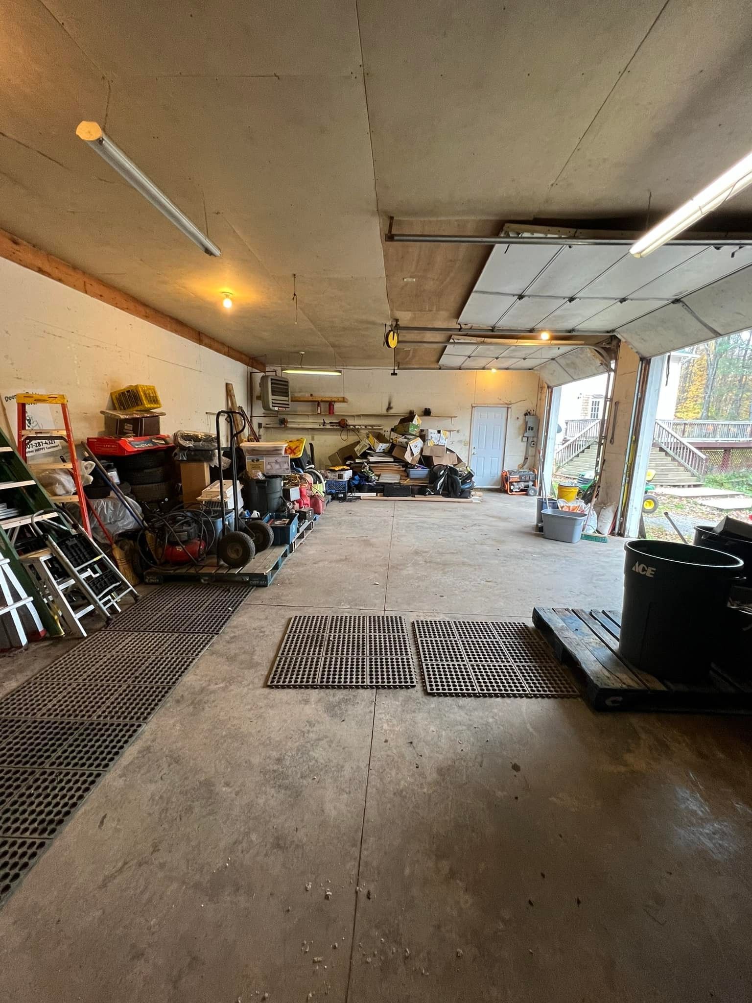 A large garage filled with lots of tools and equipment.