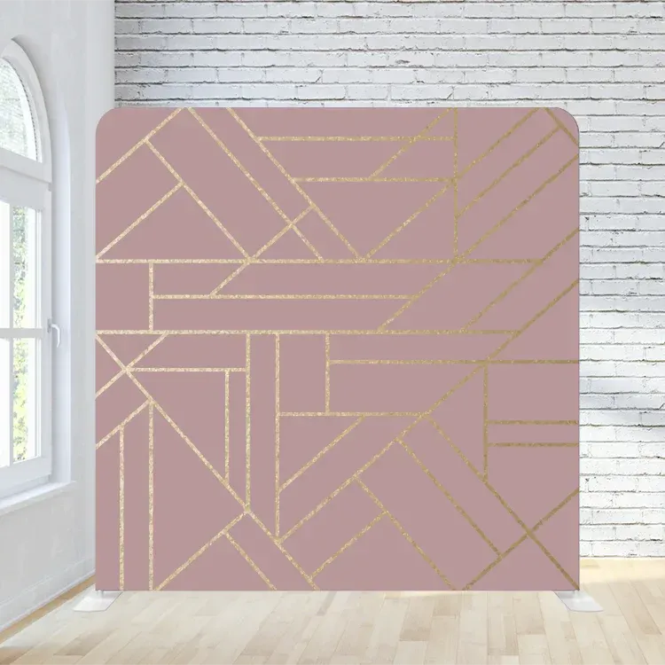 A room with a pink and gold geometric pattern on the wall.