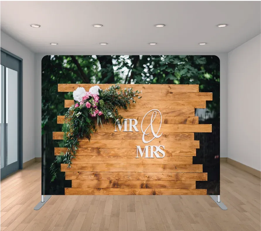 A wooden wall with the words mr and mrs on it