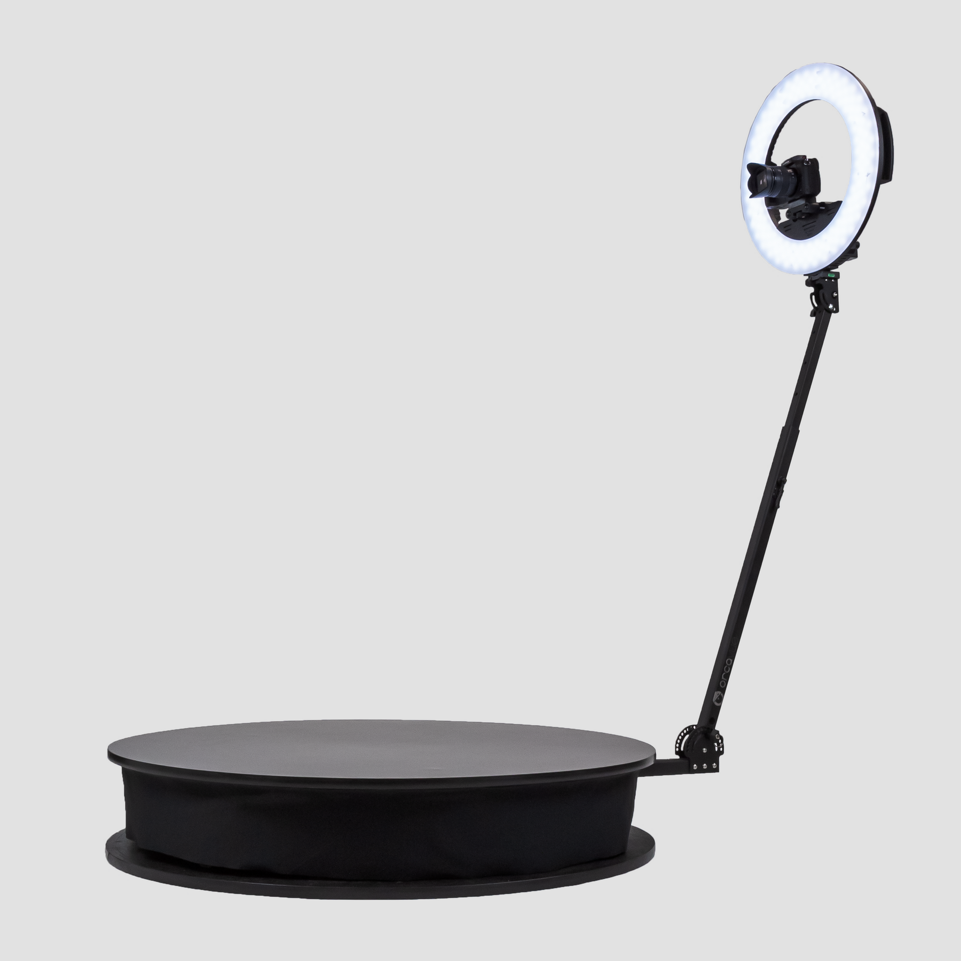 A photo booth with a ring light attached to it.