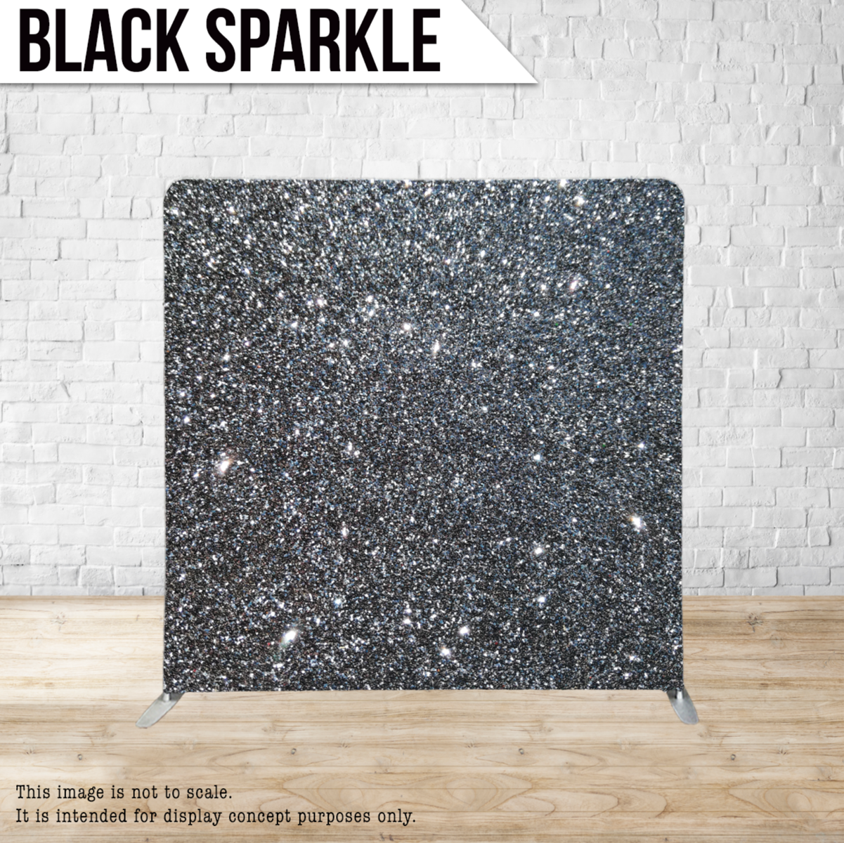 A black sparkle backdrop is against a white brick wall