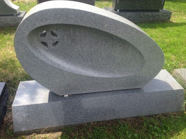 Custom granite headstone with detailed sandblasted design from Portsmouth Monument Co.