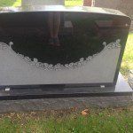 Custom laser-etched portrait on granite headstone by Portsmouth Monument Co.