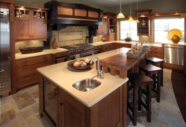 Kitchen with stone island and bar seating