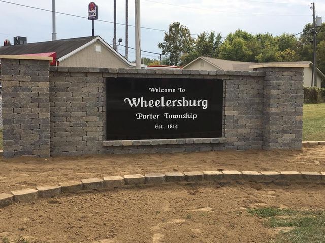 A sign that says welcome to wheelersburg porter township