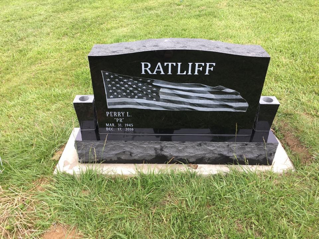 A black gravestone with the name ratliff on it