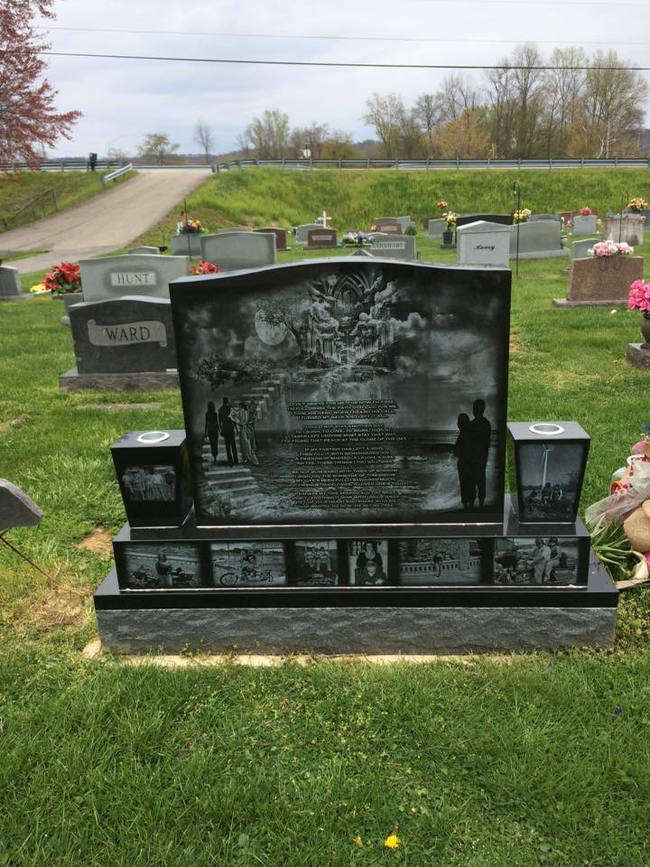 A gravestone in a cemetery with a picture of a man and woman on it.