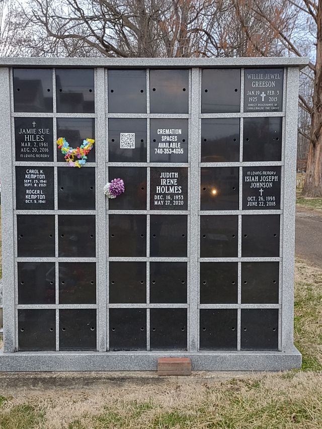A cemetery with a memorial for a man named robert holmes