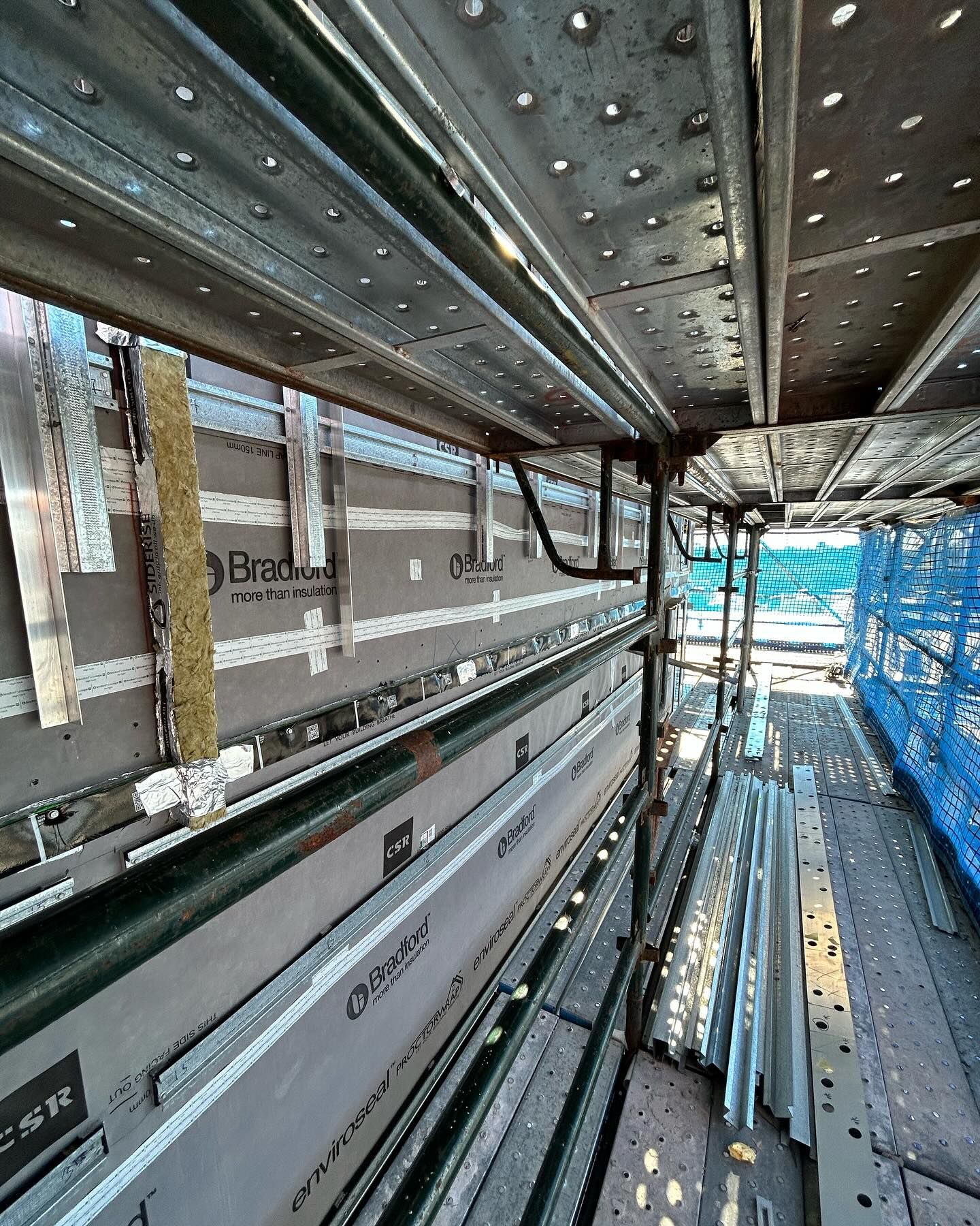 Metal Beams and Planks With Insulation Visible — Hunter Fire & Safety in Central Coast, NSW