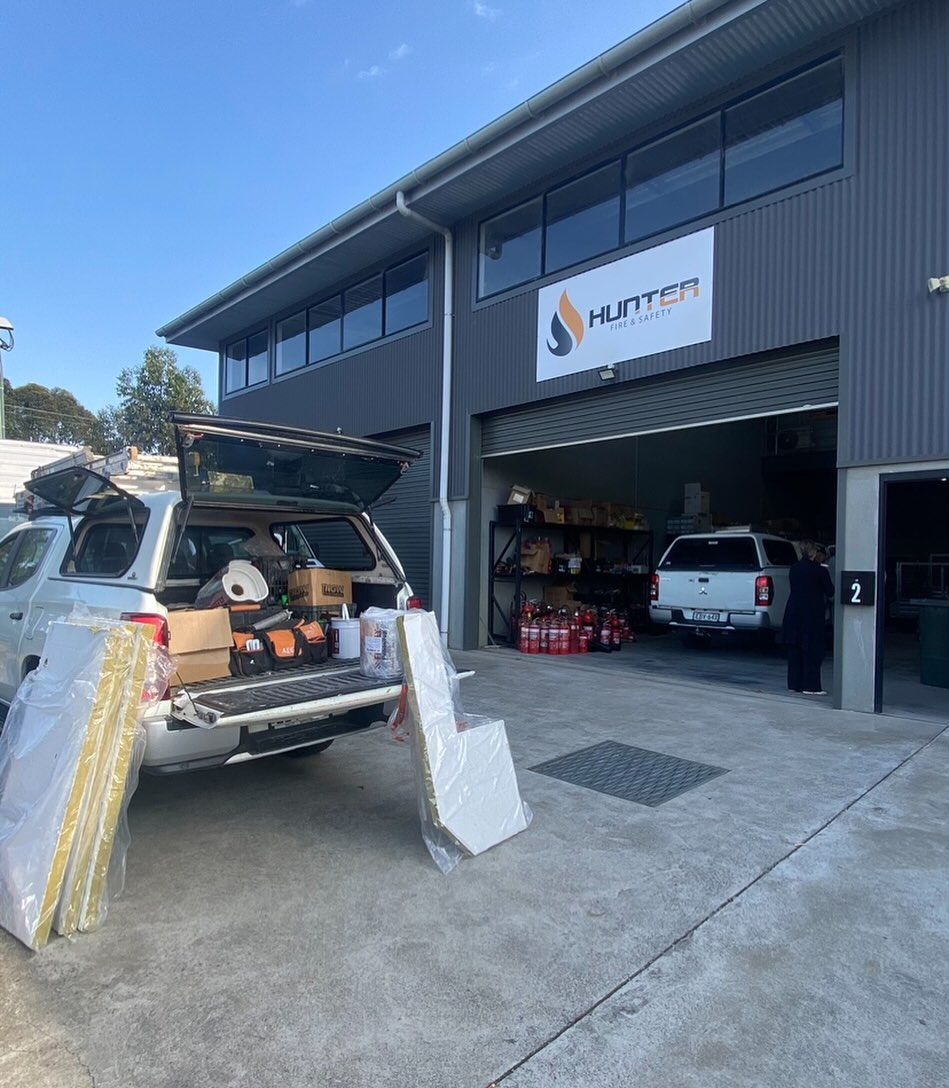 A Truck Parked Outside a Business With Its Bed Open — Hunter Fire & Safety in Port Macquarie, NSW