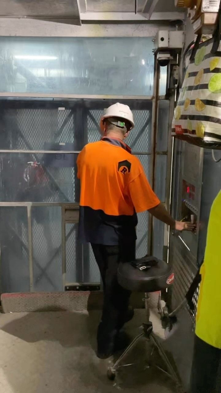 Construction Worker Operating a Construction Hoist — Hunter Fire & Safety in Central Coast, NSW