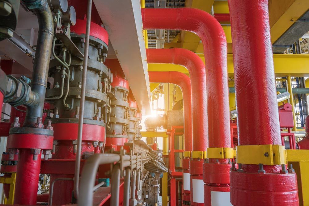 Red and Yellow Industrial Pipes, Valves, and Equipment — Hunter Fire & Safety in Edgeworth, NSW
