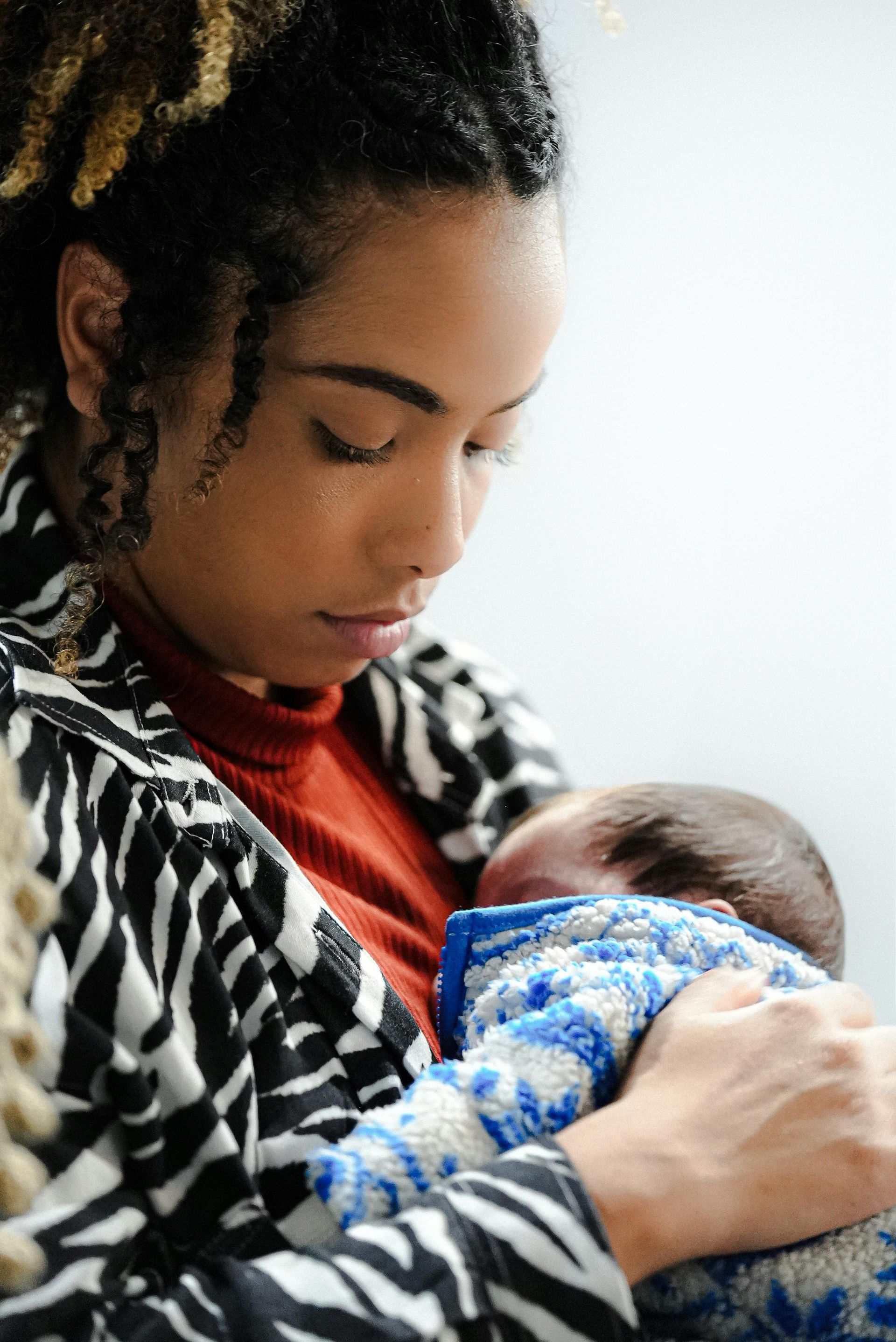 Exhausted mother with newborn