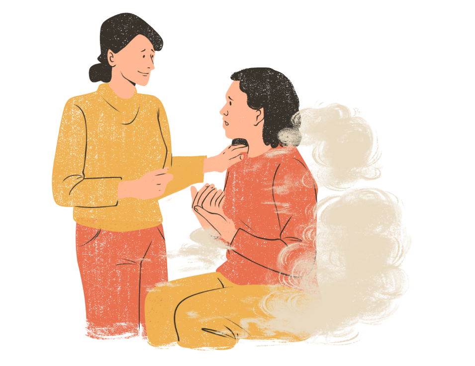 Two women are standing next to each other and talking to each other.