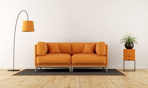 Modern living room with orange couch - Furniture Repair in Greenville, OH