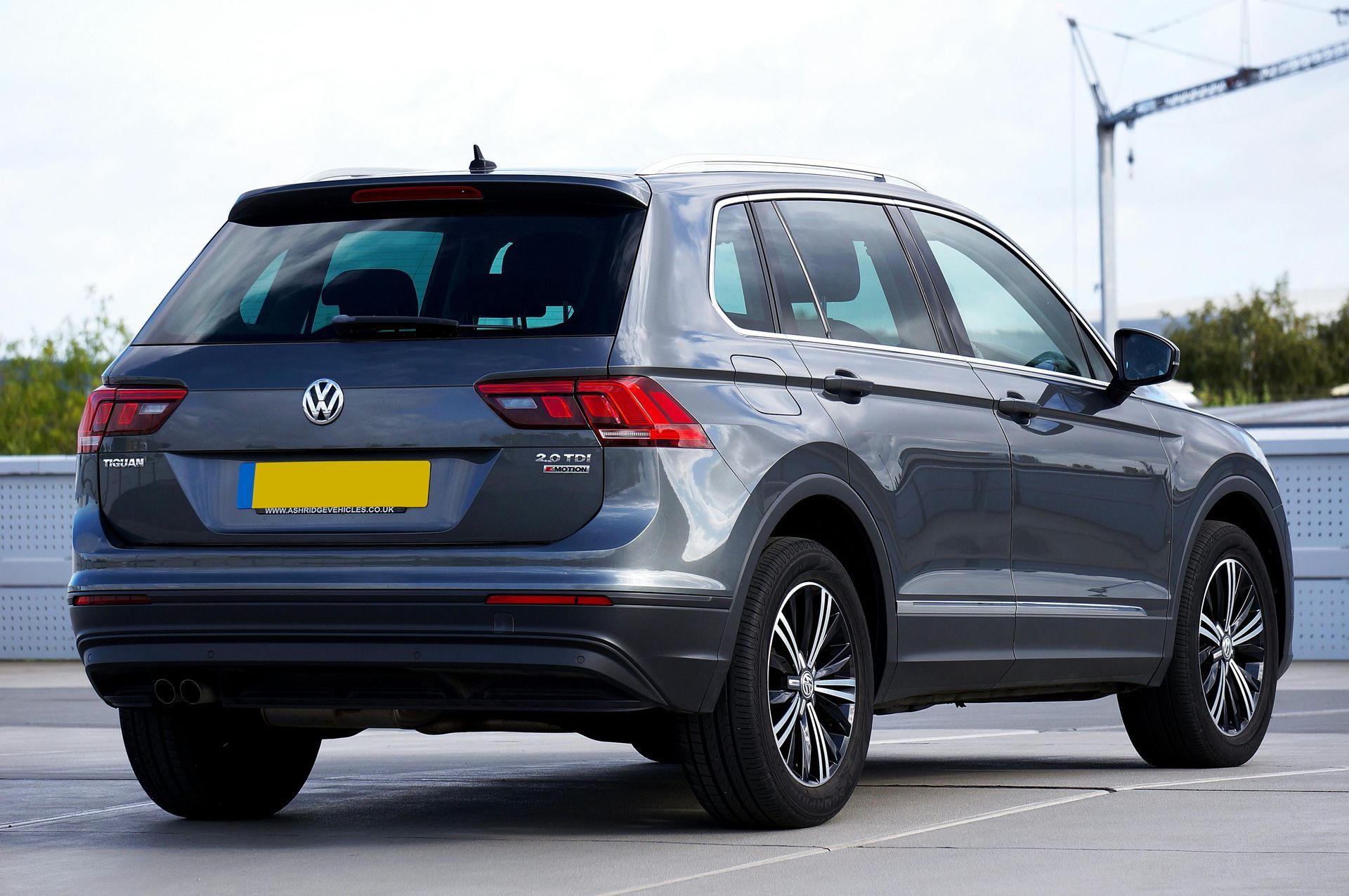 rear view of a teal blue Volkswagen SUV
