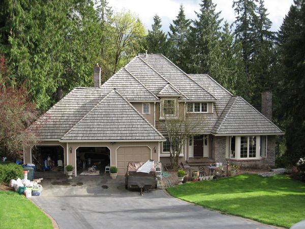 A large house with a cedar shingle roof