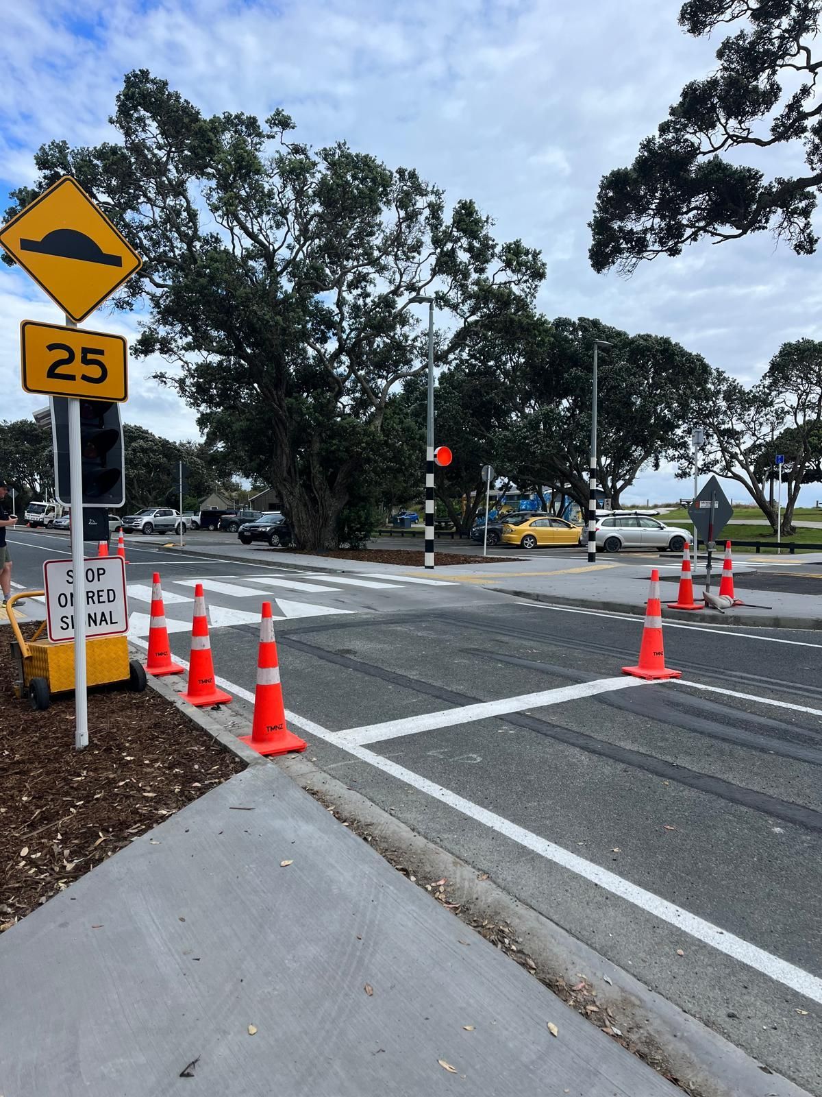 A yellow sign with the number 25 on it