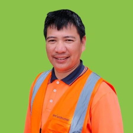 A man wearing an orange vest and an orange shirt