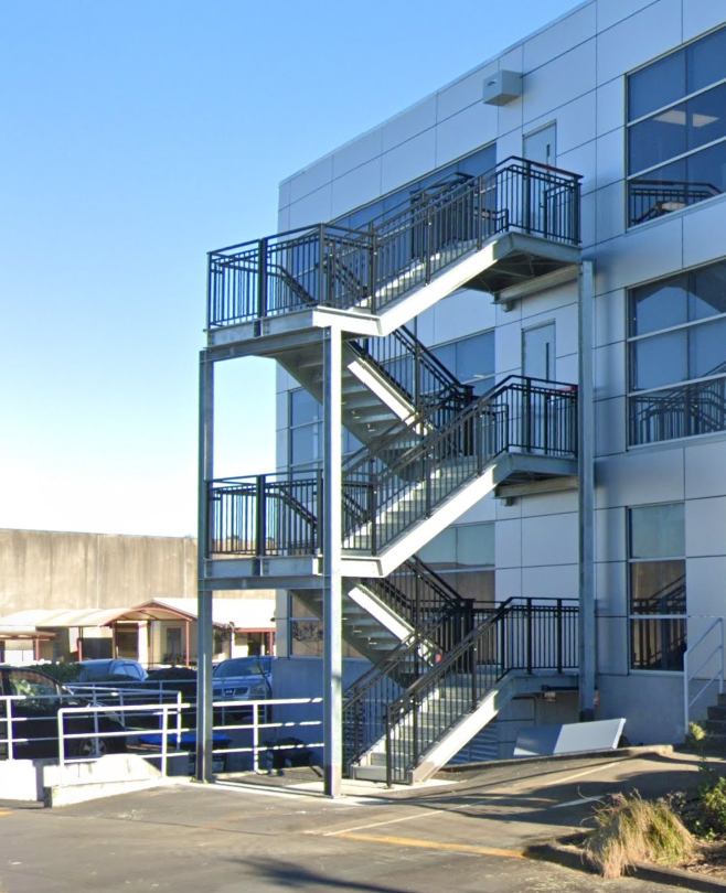 A building with stairs on the side of it