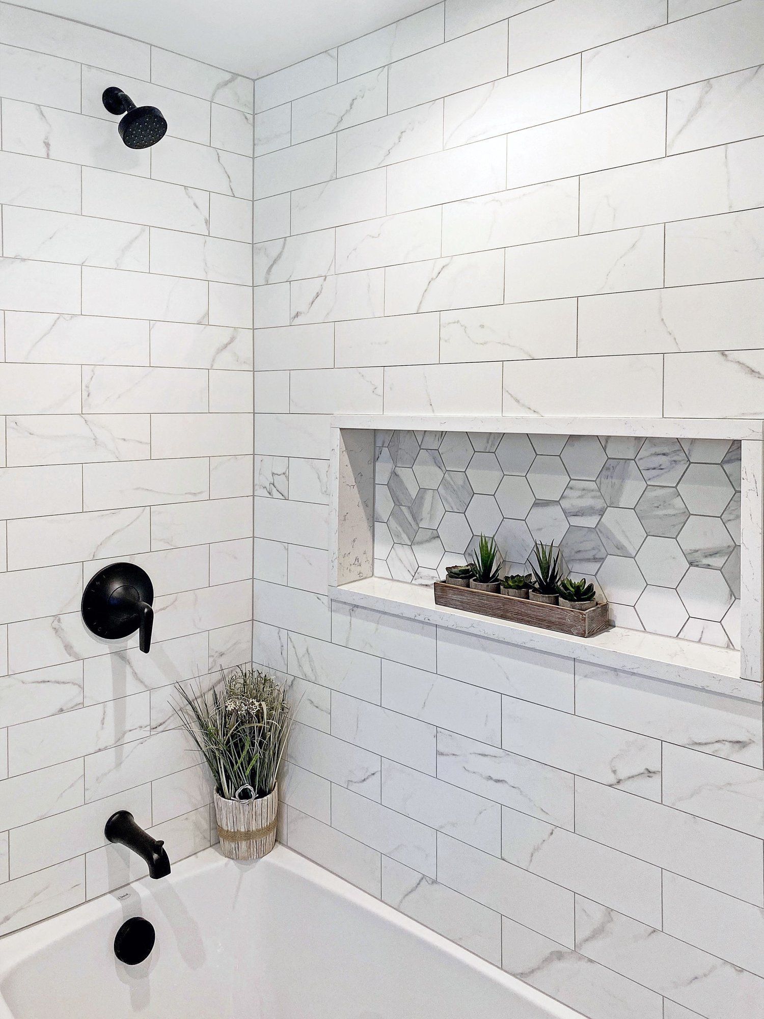 Spotless bathroom tile wall after tile and grout cleaning and sealing service
