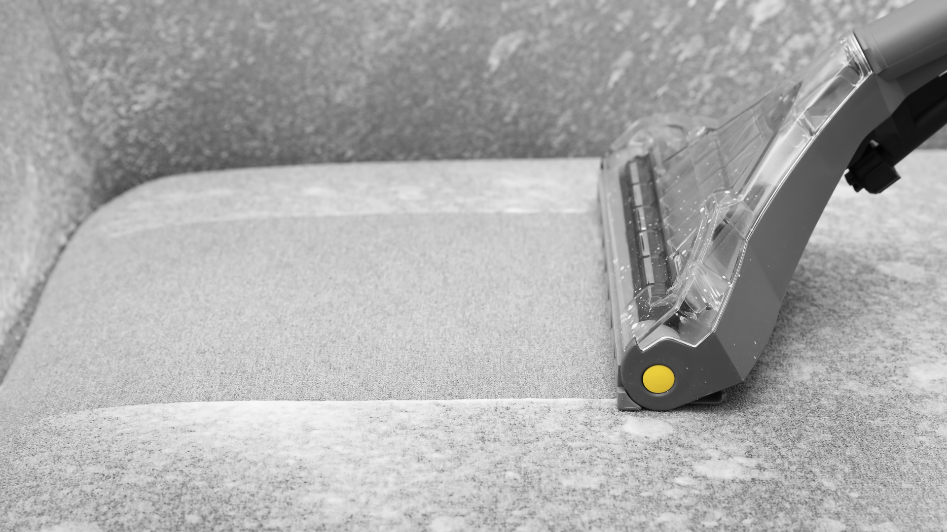 Upholstery steam cleaning tool lifting dirt from chair for professional fabric refresh
