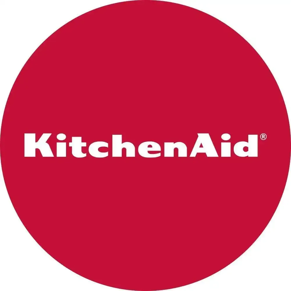 a kitchenaid logo in a red circle on a white background