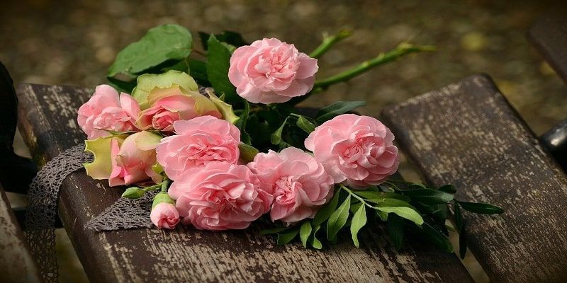 Pink memorial flowers on a bench for Kent WA funeral and cremation services