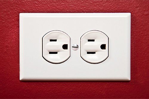 Electrical Outlet In Red Wall