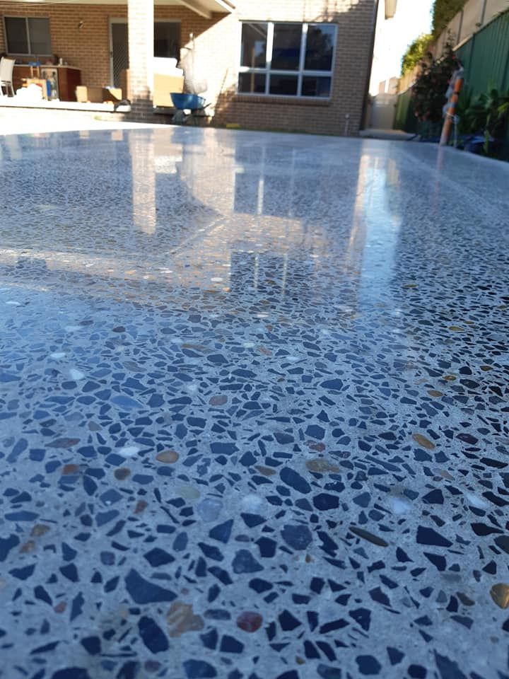 A Polished Concrete Patio Featuring Exposed Aggregate in Shades of Grey — JDB Concreting in Horsley, NSW
