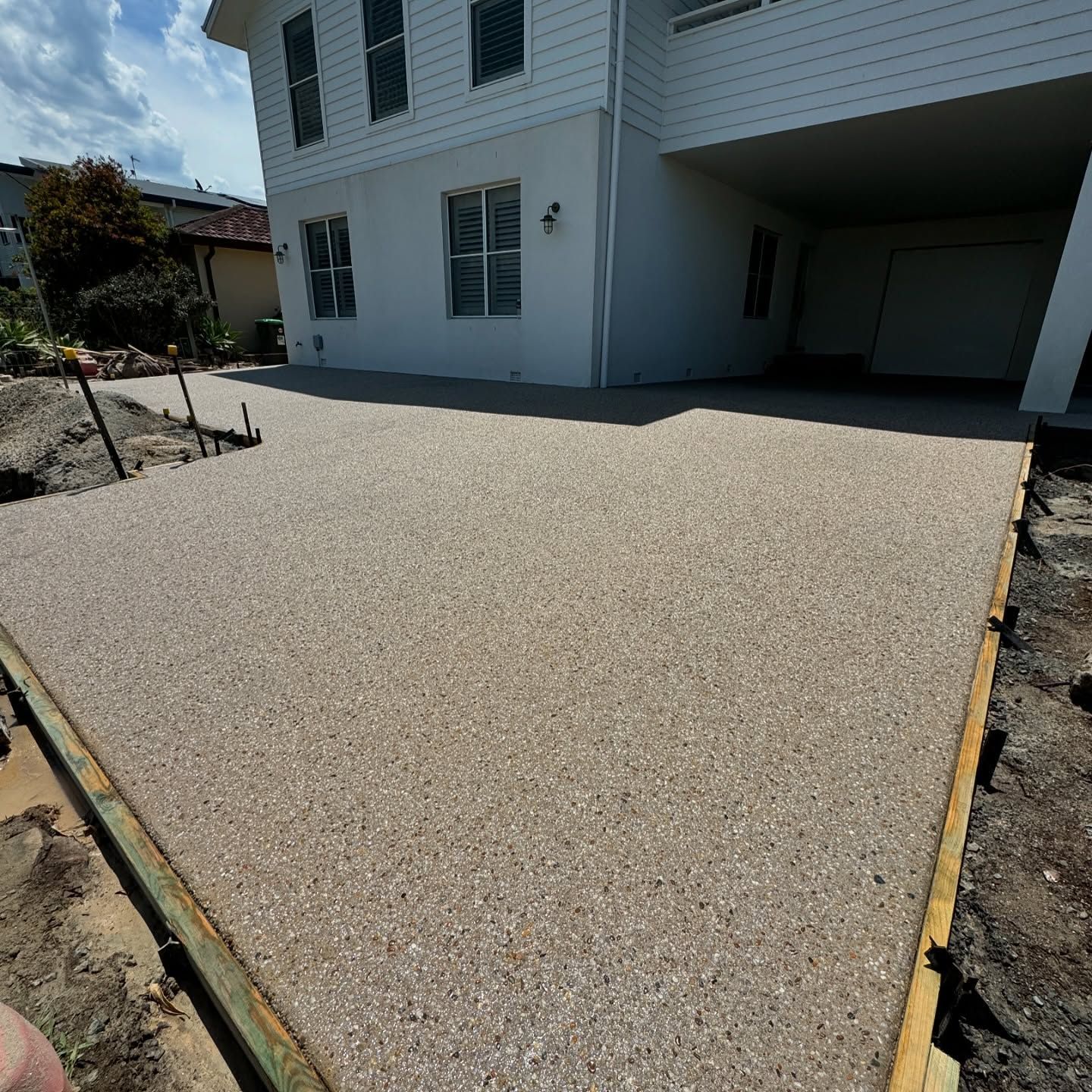 A Newly Poured Aggregate Concrete Patio Framed by Wood Forms — JDB Concreting in Robertson, NSW