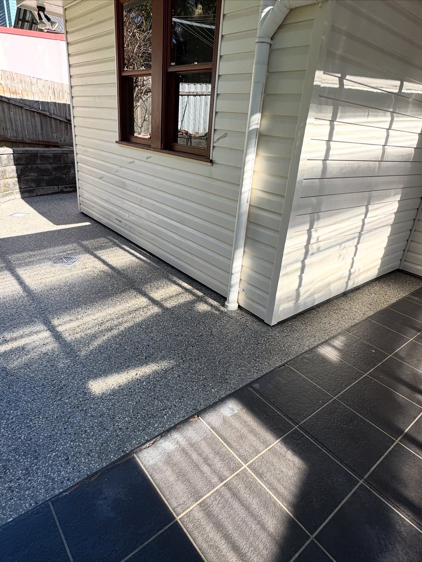 A House Exterior Featuring Light-coloured Horizontal Siding — JDB Concreting in Albion Park, NSW