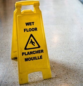 Wet Floor Sign In Hallway — Floor in Fort Walton Beach, FL