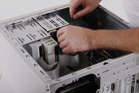 an engineer fixing a computer