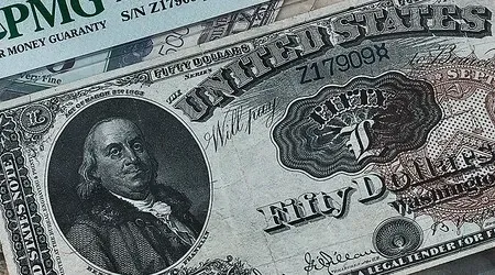 A black and white photo of a fifty dollar bill