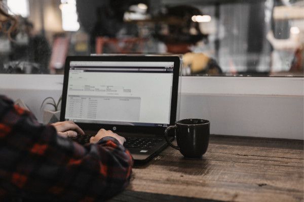 Working on a laptop | Baker Garage Volvo Specialists