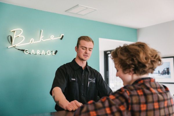 People at front desk | Baker Garage Volvo Specialists