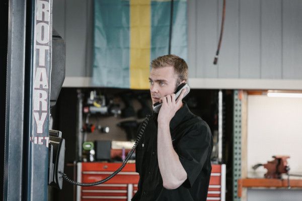 A person talking on the phone | Baker Garage Volvo Specialists
