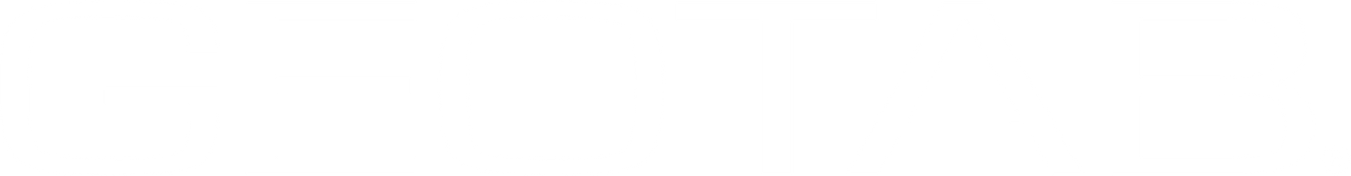 A man and a woman are looking at a computer screen.