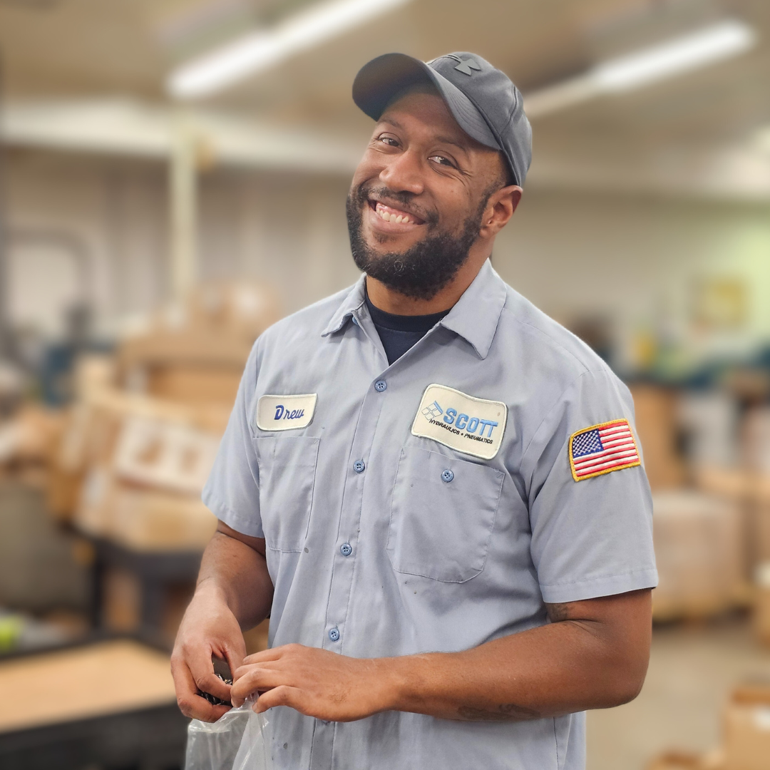 A man wearing a hat and a shirt with the word safety on it